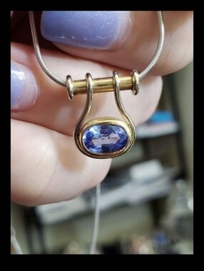 14k tanzanite necklace! White gold snake chain and the pendant is yellow gold. T